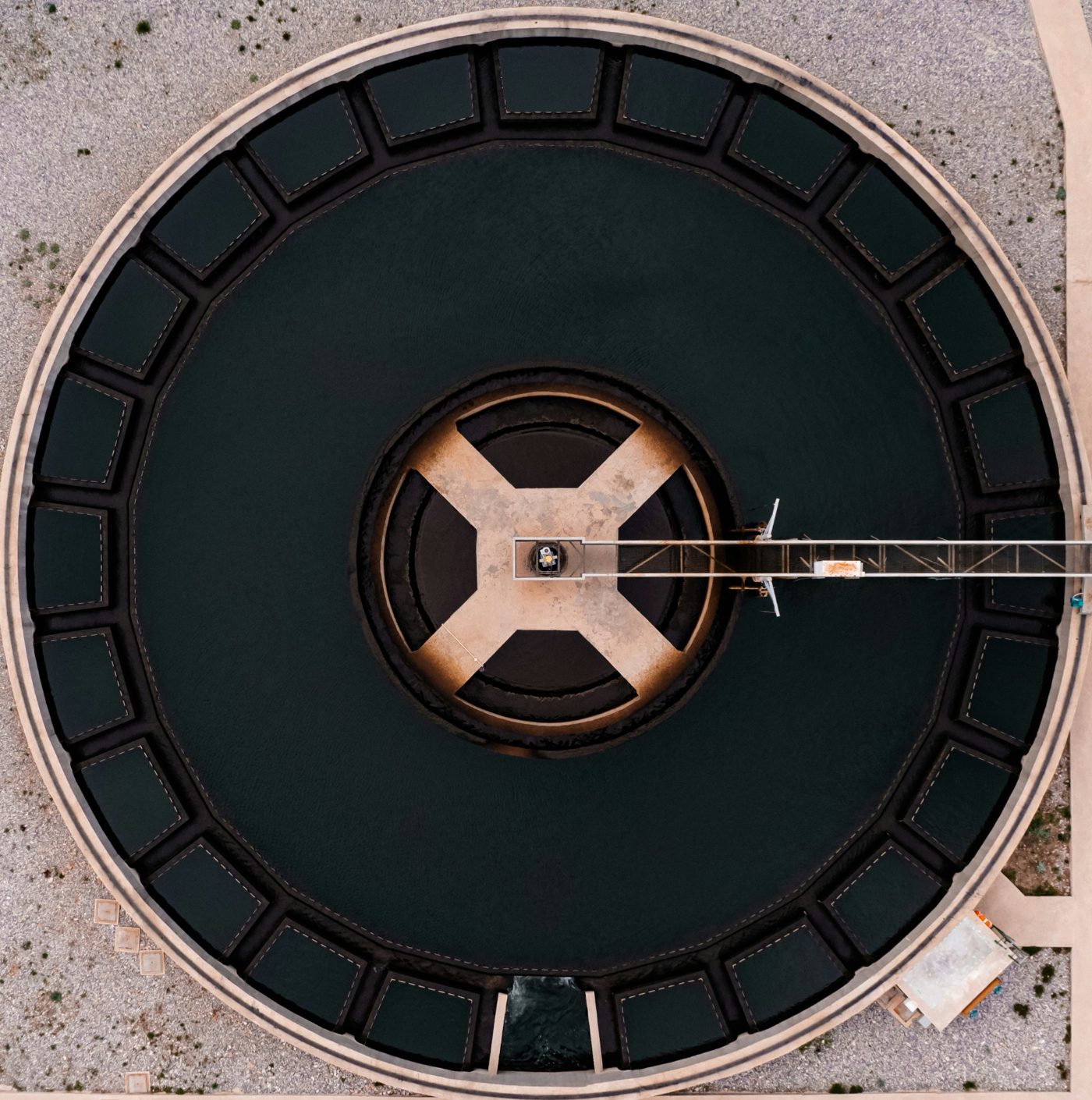 Aerial view of a circular clarifier at a water treatment plant